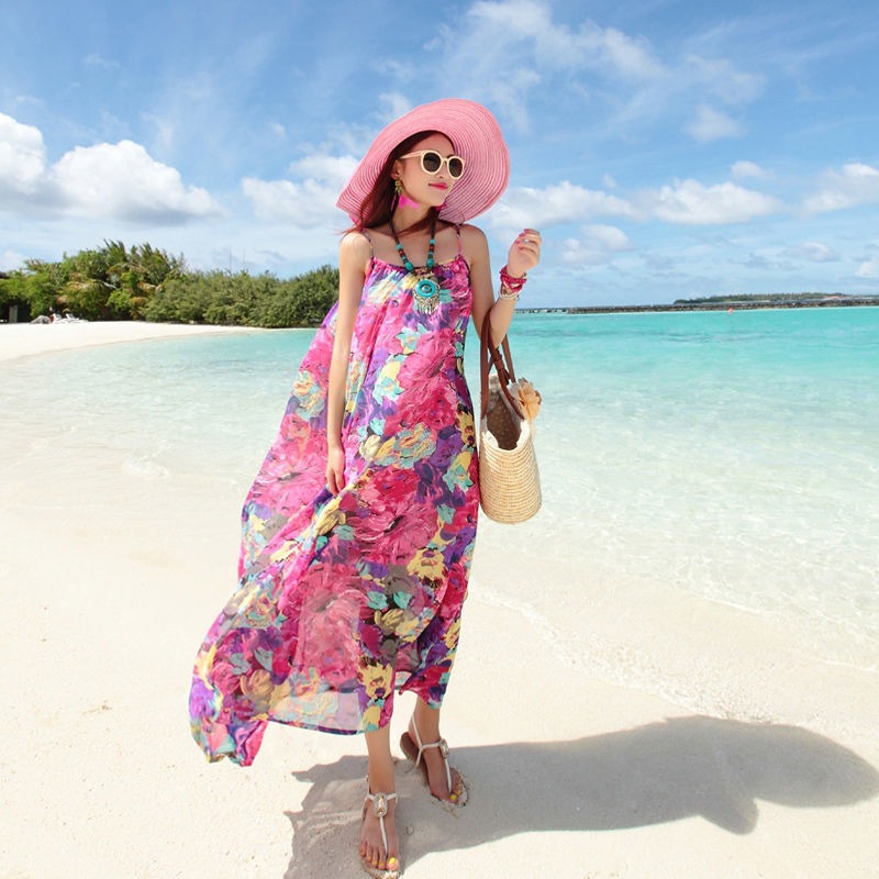 ชุดเดรสยาวสีชมพูลายดอกไม้ สายเดี่ยว เดรสทรงปล่อย ชุดใส่เดินเล่นถ่ายรูปริมชายหาดสวยๆ แฟชั่นชุดไปทะเล ชุดเที่ยวทะเล