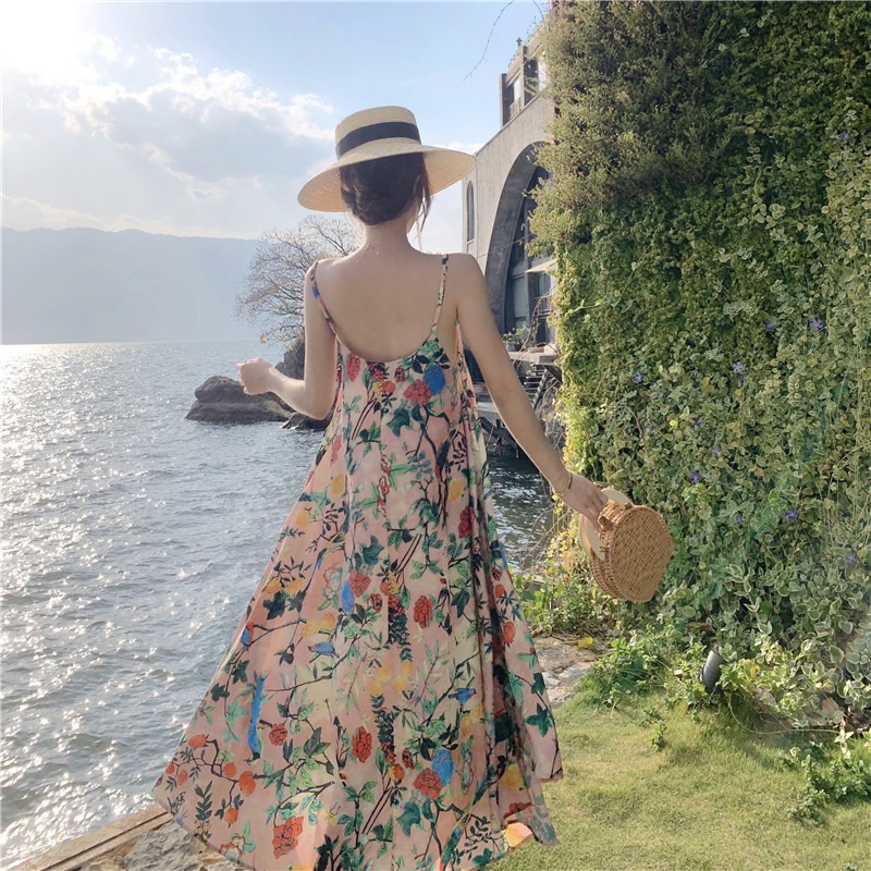 ชุดใส่เที่ยวทะเล เดรสยาวสีชมพูลายดอกไม้ สายเดี่ยว ผ้าชีฟอง ทรงปล่อย แฟชั่นชุดใส่เที่ยวทะเล ไอเดียชุดแต่งตัวไปเที่ยวทะเล ใครมีแพลนไปทะเลแต่ยังไม่ได้หาชุดต้องดู สำเนา