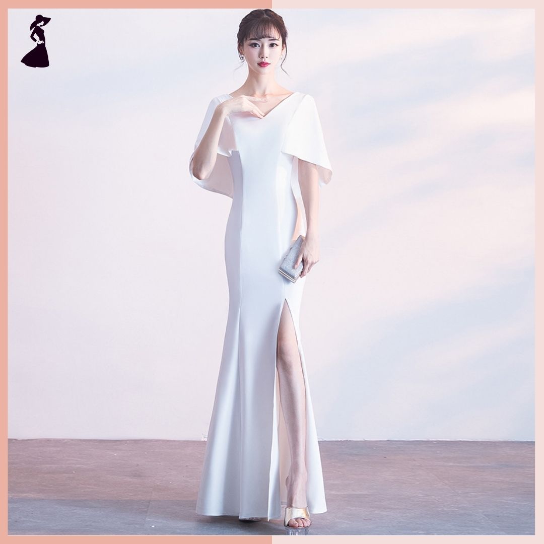 ชุดราตรี ชุดออกงาน ชุดไปงานแต่งงานสีขาว แขนทรงปีกค้างคาว กระโปรงยาวผ่าหน้า แนวเรียบหรู สวยหรูดูแพง