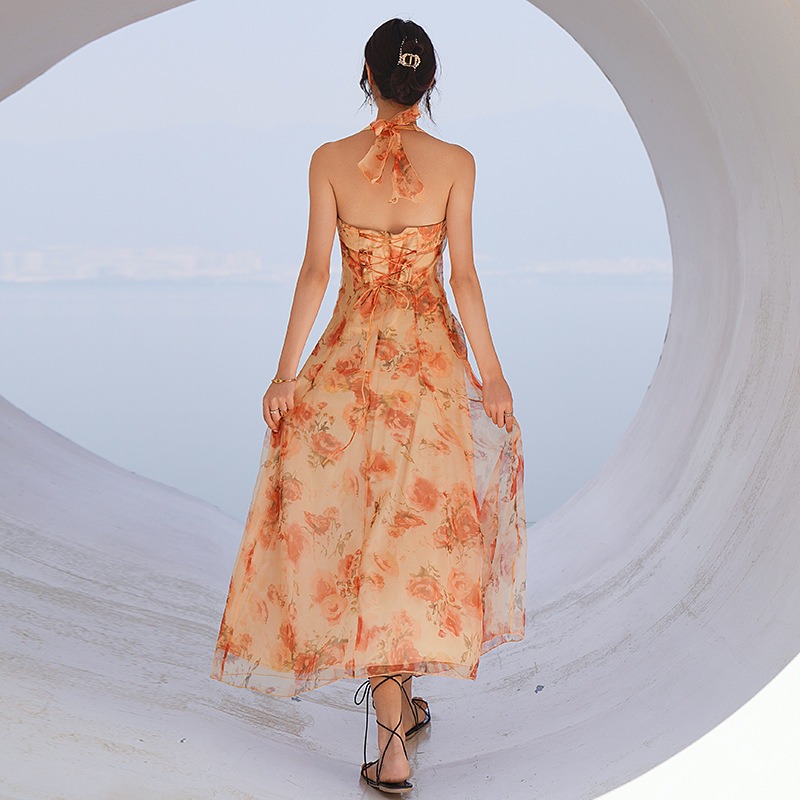 ชุดเดรสยาวลายดอกสีเหลือง ผูกคอ กระโปรงทรงบาน แฟชั่นชุดไปทะเล ชุดเที่ยวทะเล ชุดใส่เดินเล่นถ่ายรูปริมชายหาดสวยๆ