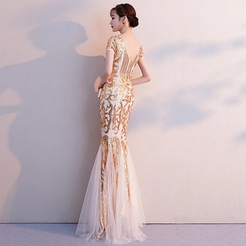 ชุดราตรียาวสีทอง ปักคริสตรัล ทรงหางปลา ลุคสวยหรูดูแพง เหมาะสำหรับใส่เป็นชุดราตรีออกงาน ชุดไปงานแต่ง ชุดรับรางวัล