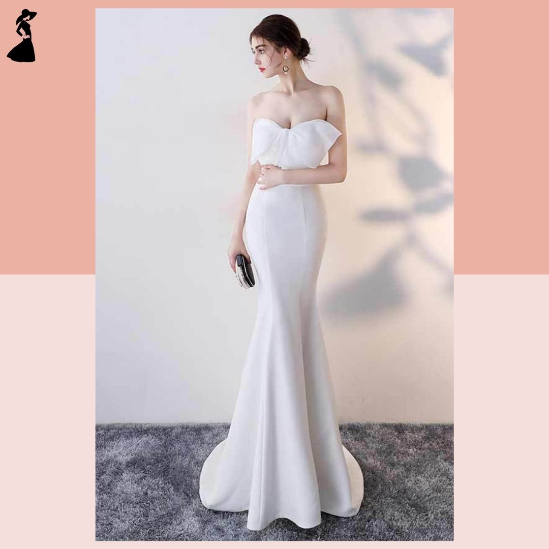 ชุดราตรี ชุดออกงาน ชุดไปงานแต่งงานสีขาว เดรสยาวเกาะอกแต่งโบว์ กระโปรงยาวทรงหางปลา แนวเรียบหรู สวยสง่า ดูแพง
