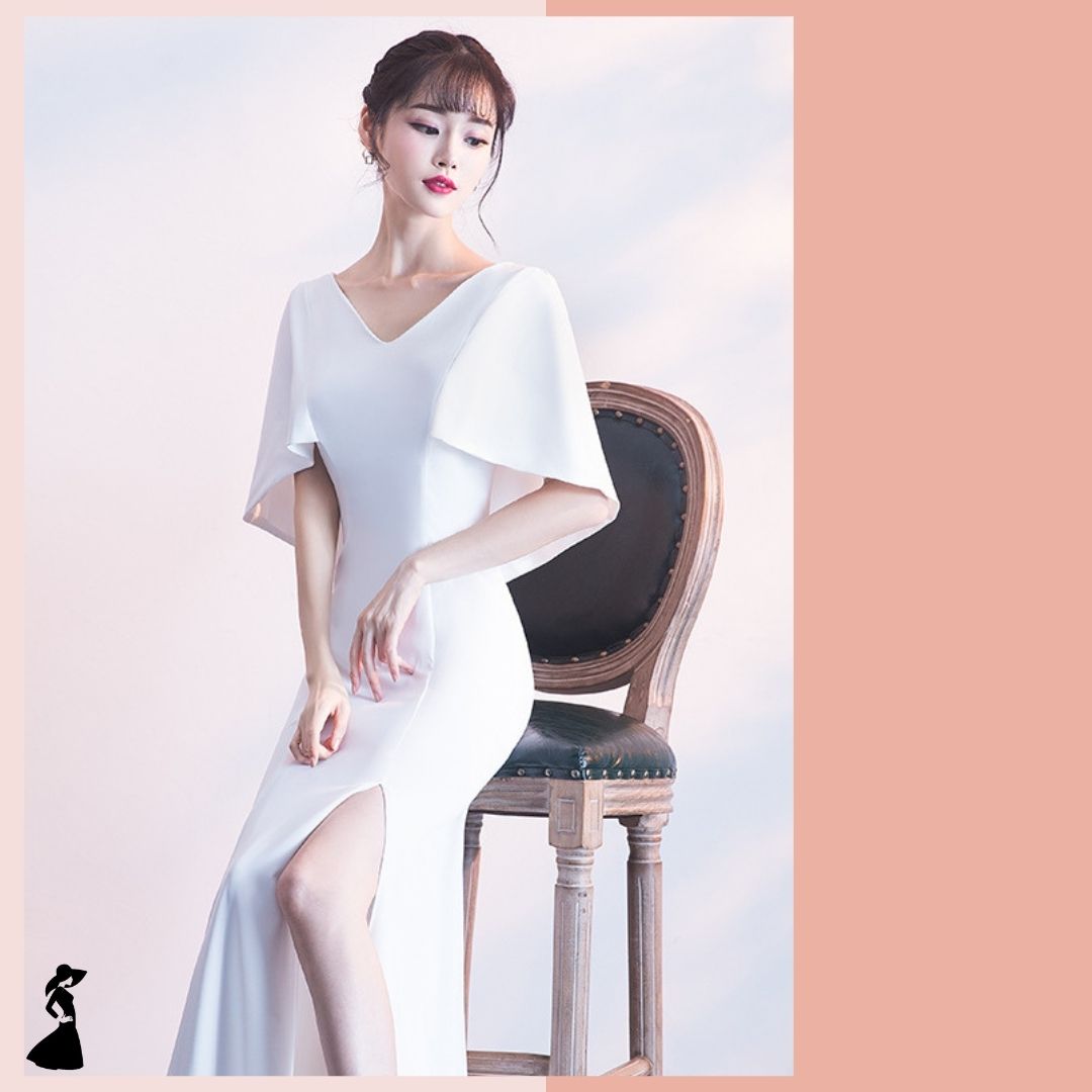 ชุดราตรี ชุดออกงาน ชุดไปงานแต่งงานสีขาว แขนทรงปีกค้างคาว กระโปรงยาวผ่าหน้า แนวเรียบหรู สวยหรูดูแพง