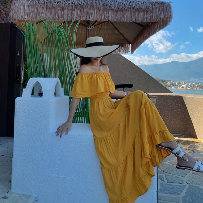 แม็กซี่เดรสยาวเปิดไหล่สีเหลือง กระโปรงยาวทรงบาน แฟชั่นชุดไปทะเล ชุดเที่ยวทะเล ชุดใส่เดินเล่นถ่ายรูปริมชายหาดสวยๆ