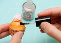 A glossy finish helps enhance the visual appearance of fruit replicas, thereby heightening their realism.