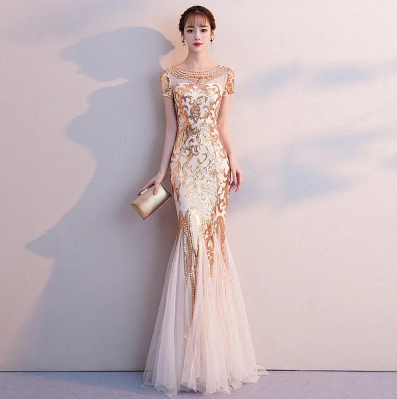 ชุดราตรียาวสีทอง ปักคริสตรัล ทรงหางปลา ลุคสวยหรูดูแพง เหมาะสำหรับใส่เป็นชุดราตรีออกงาน ชุดไปงานแต่ง ชุดรับรางวัล
